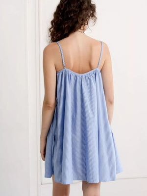 Blue striped spaghetti strap mini dress with a gathered neckline.