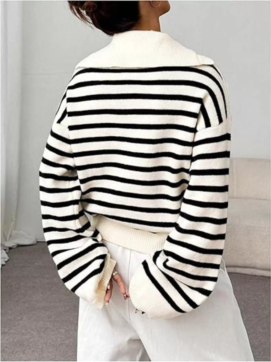 Black and white striped long-sleeve sweater with a spread collar and ribbed cuffs.