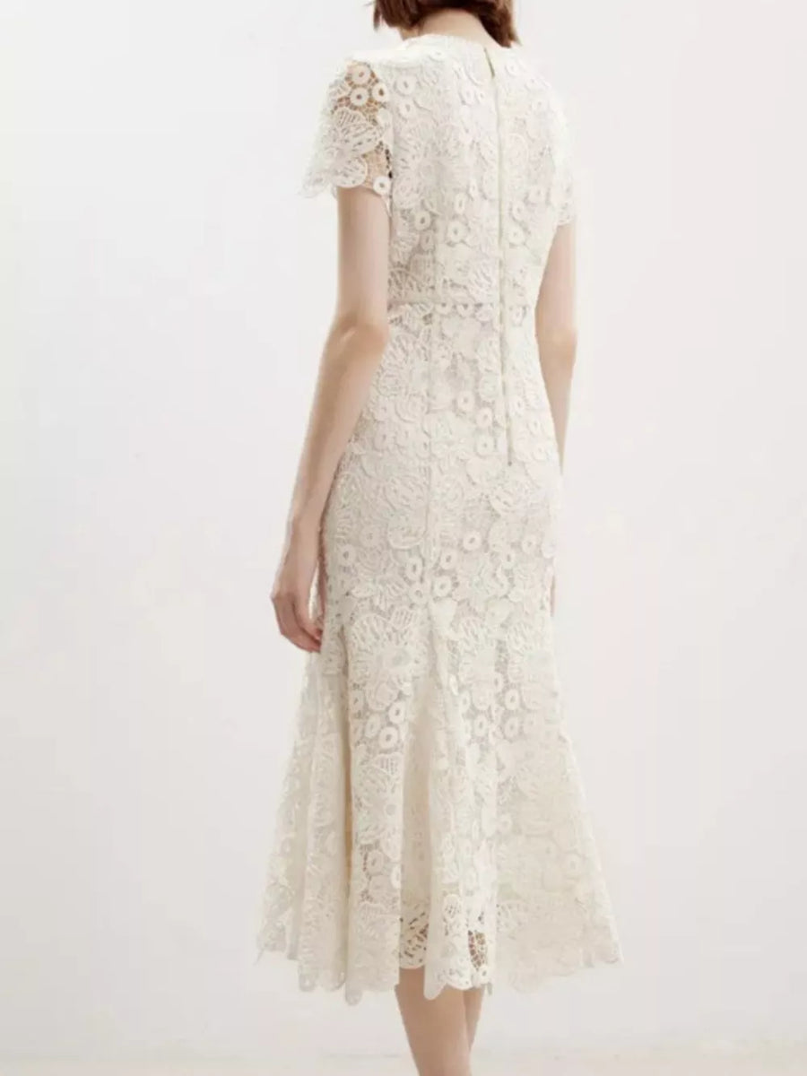 Cream floral lace mermaid evening gown with cap sleeves and a flared hem.