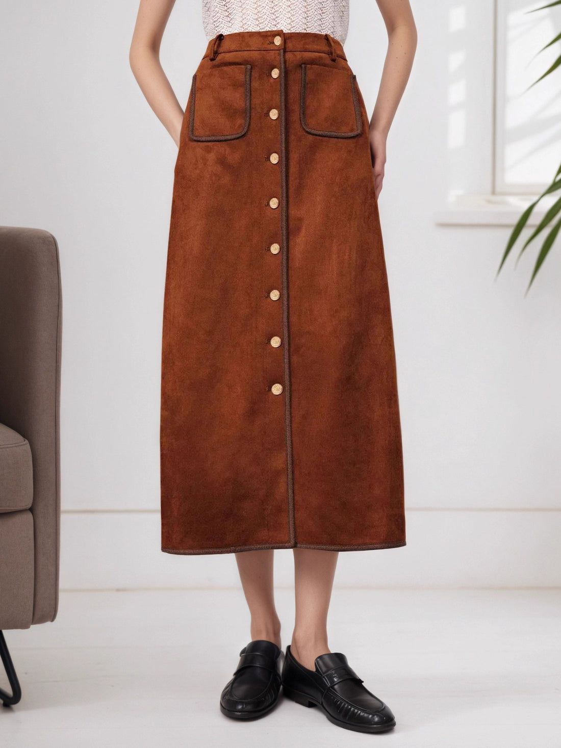 midi skirt in rust featuring button-front and A-line fit
