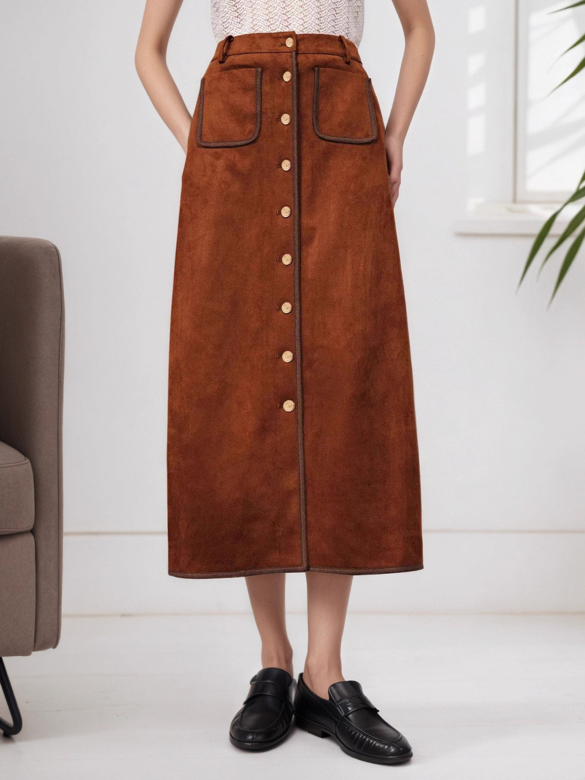 midi skirt in rust featuring button-front and A-line fit