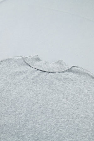 light gray sweatshirt with exposed seam and long sleeve