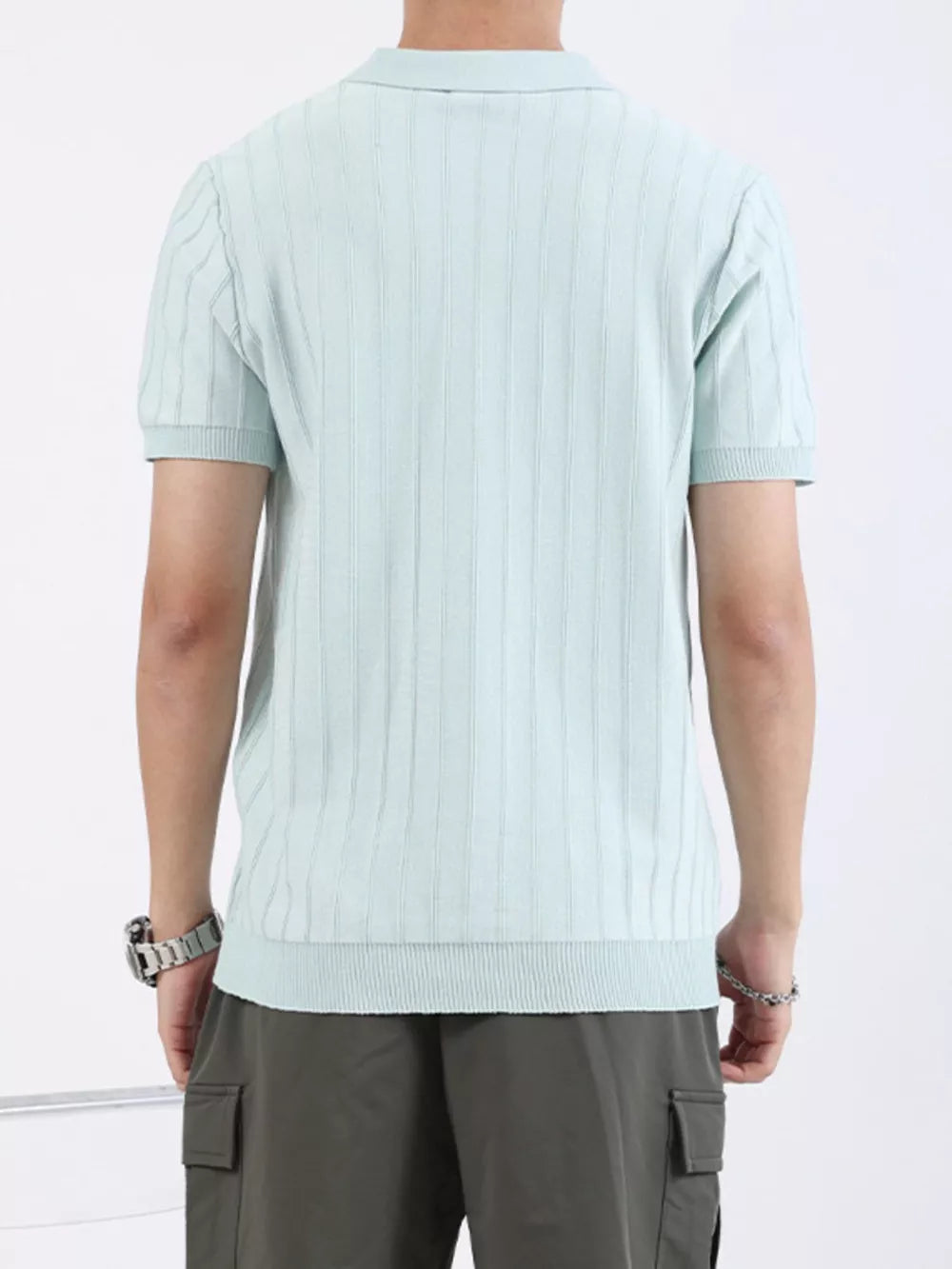 Light blue ribbed knit polo shirt for men with short sleeves and a classic collar.