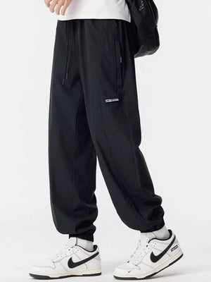Black jogger sweatpants with drawstring and cargo pocket detail