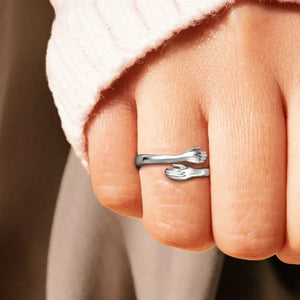 ring in silver featuring hug design and bypass fit
