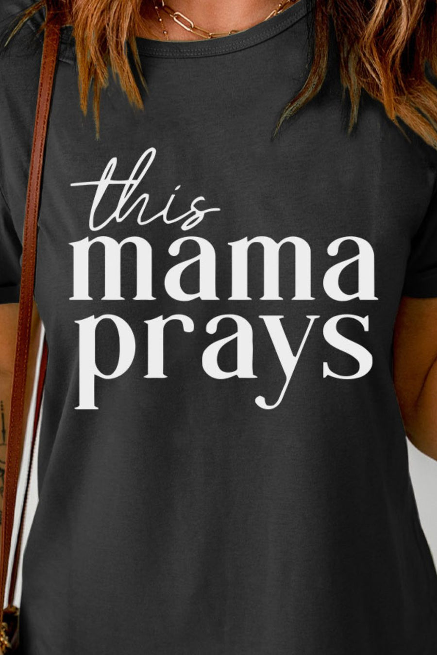 Black graphic tee with white text that reads "this mama prays