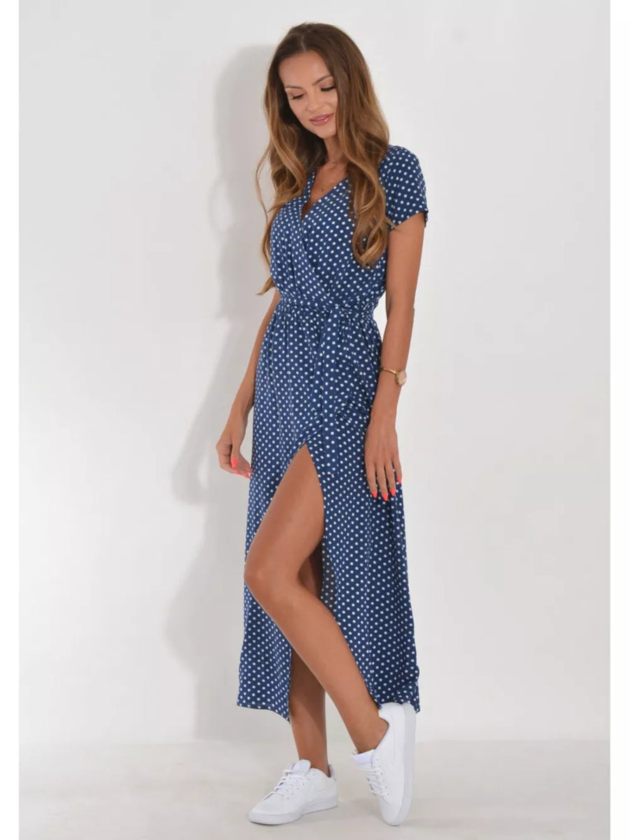 Blue polka dot wrap maxi dress with short sleeves and a high slit.