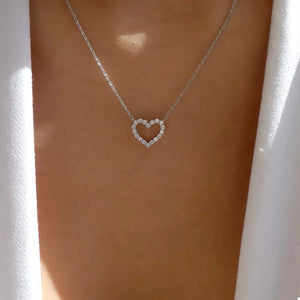 Silver heart pendant necklace with clear stones on a delicate chain
