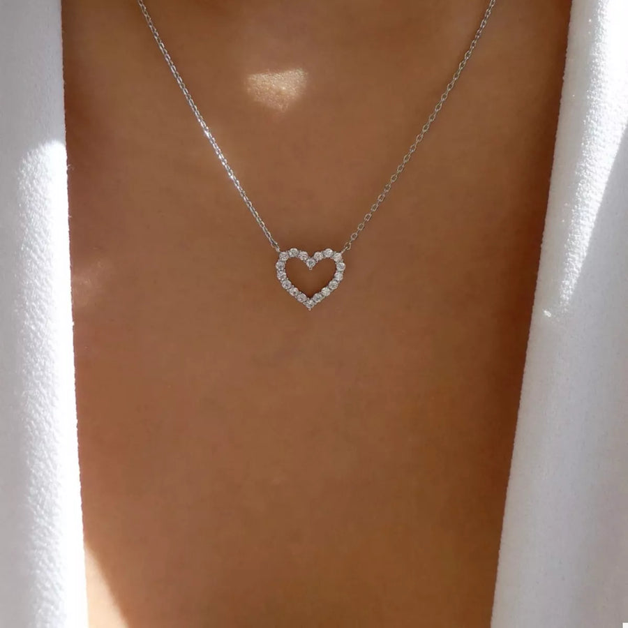 Silver heart pendant necklace with clear stones on a delicate chain