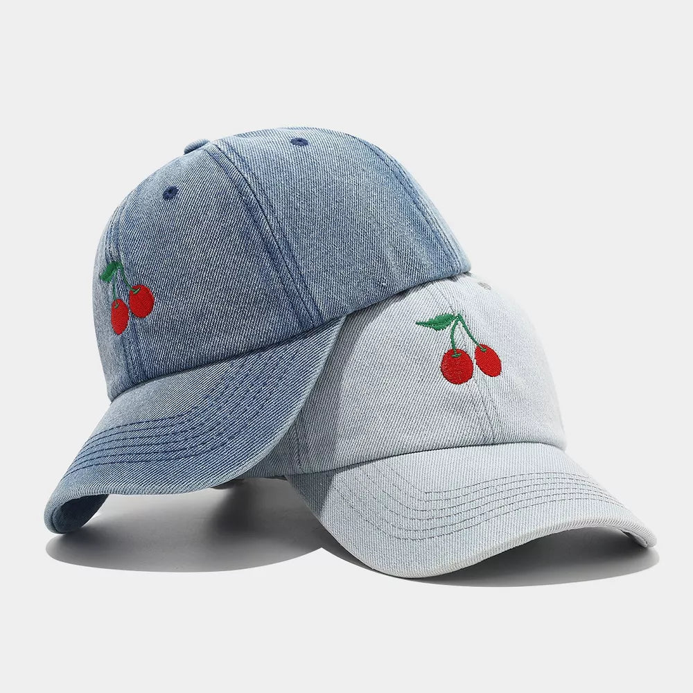 cap in medium wash denim featuring embroidered detail and structured fit