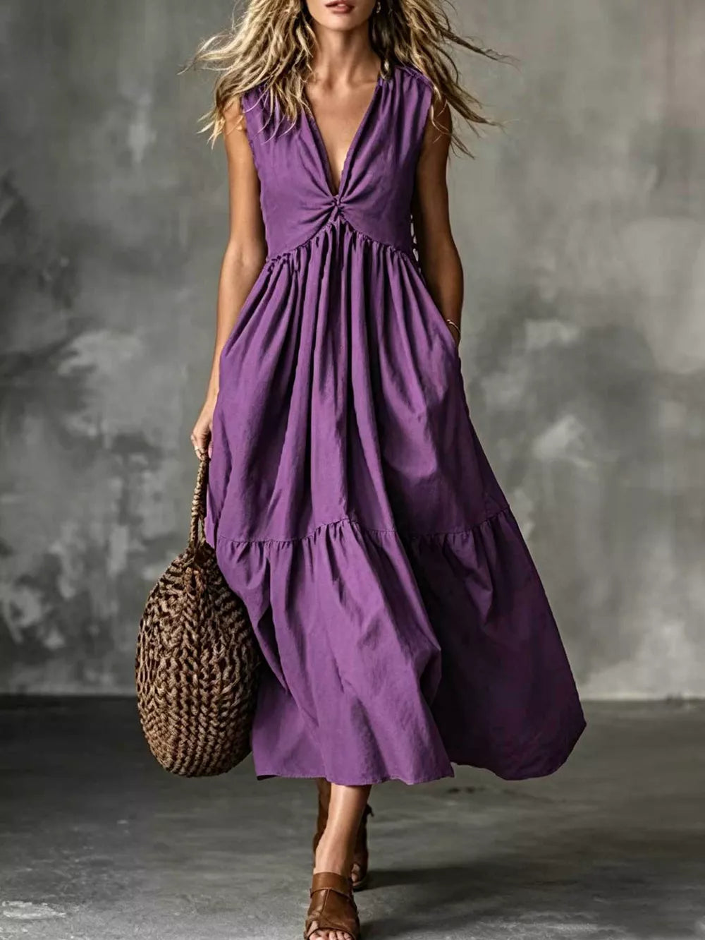 Purple sleeveless maxi dress with knotted V-neck, tiered skirt, and pockets.