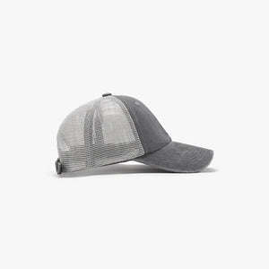 Vintage wash trucker hat in dark gray with a mesh back and adjustable strap.