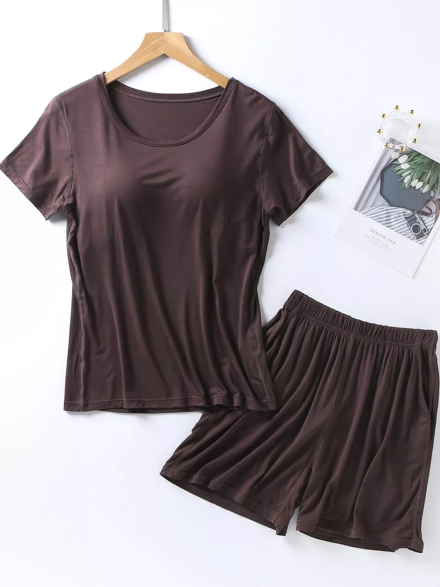 Brown two-piece pajama set with scoop neck t-shirt and elastic waist shorts with pockets.