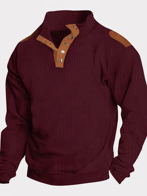 Burgundy waffle knit henley shirt with suede shoulder patches and button placket.