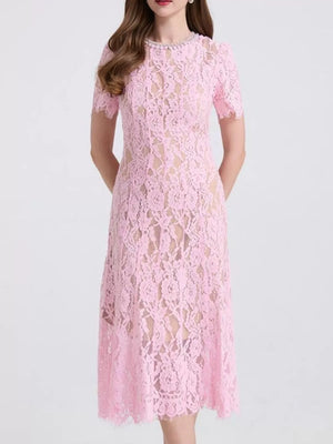 Pink lace midi dress with pearl neckline and short sleeves.