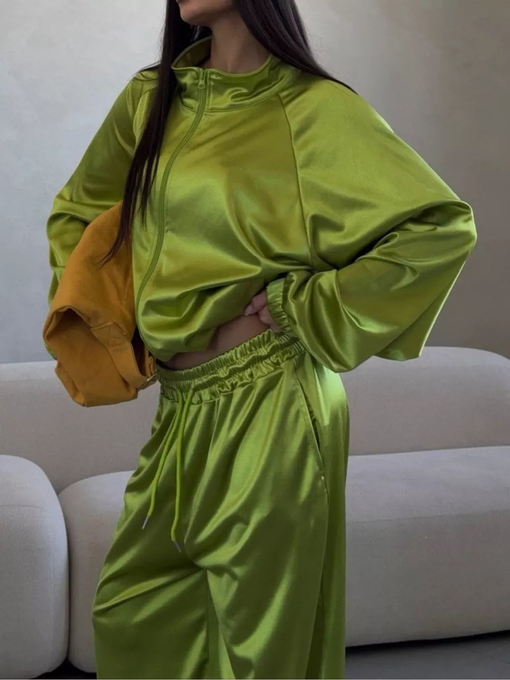 track jacket in lime green featuring drawstring and relaxed fit