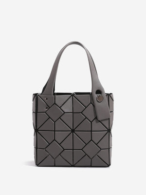 Black handbag featuring geometric panels and geometric