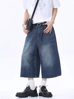 Vintage wash wide-leg denim culotte shorts in dark blue, relaxed fit, cotton.