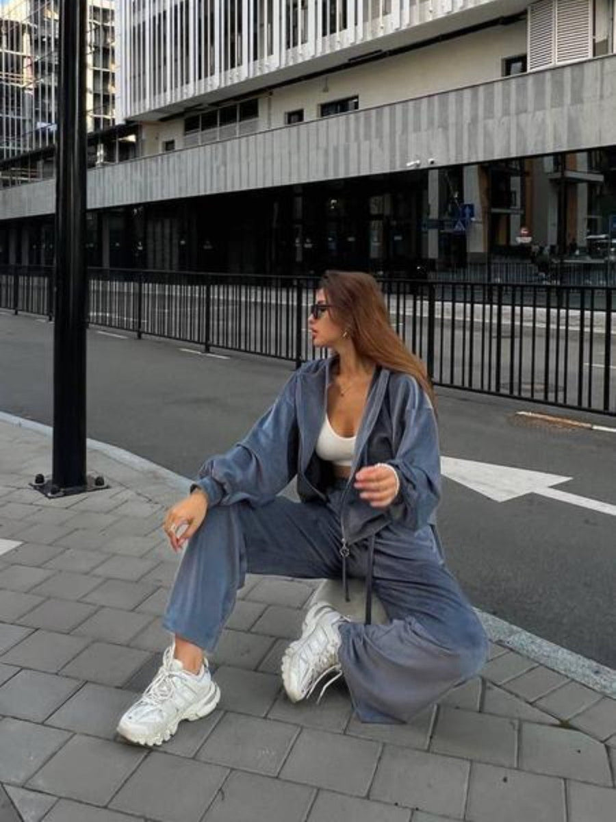 Plush velour lounge set in blue with wide leg pants and zip-up hoodie.
