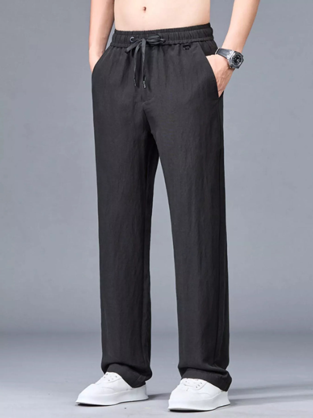 Black casual lightweight trousers with drawstring waist and pockets