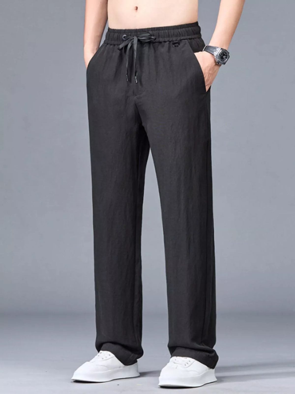 Black casual lightweight trousers with drawstring waist and pockets