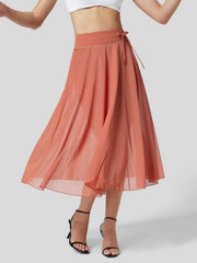 Flowy midi skirt in orange red with drawstring and shorts liner.