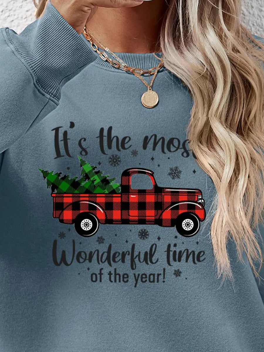 Misty Blue sweatshirt with buffalo plaid truck graphic and holiday text.
