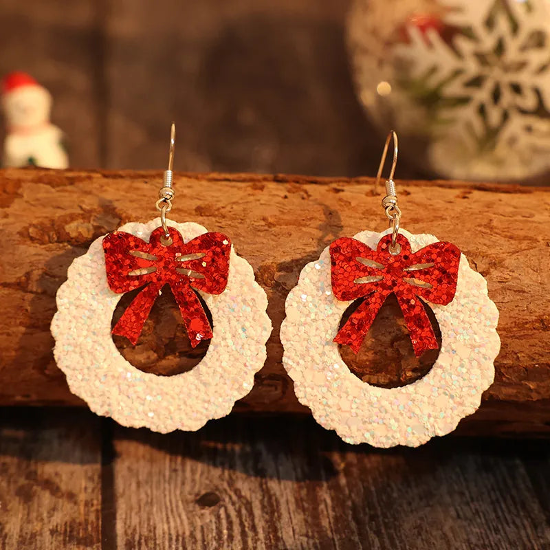 Glitter wreath drop earrings with red bows, white glitter wreaths.