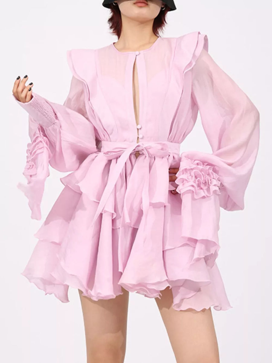 Pink tiered ruffle mini dress with button-down front and tie waist.
