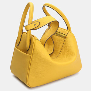 PU Leather Imported Size &amp handbag in bright yellow with rounded silhouette