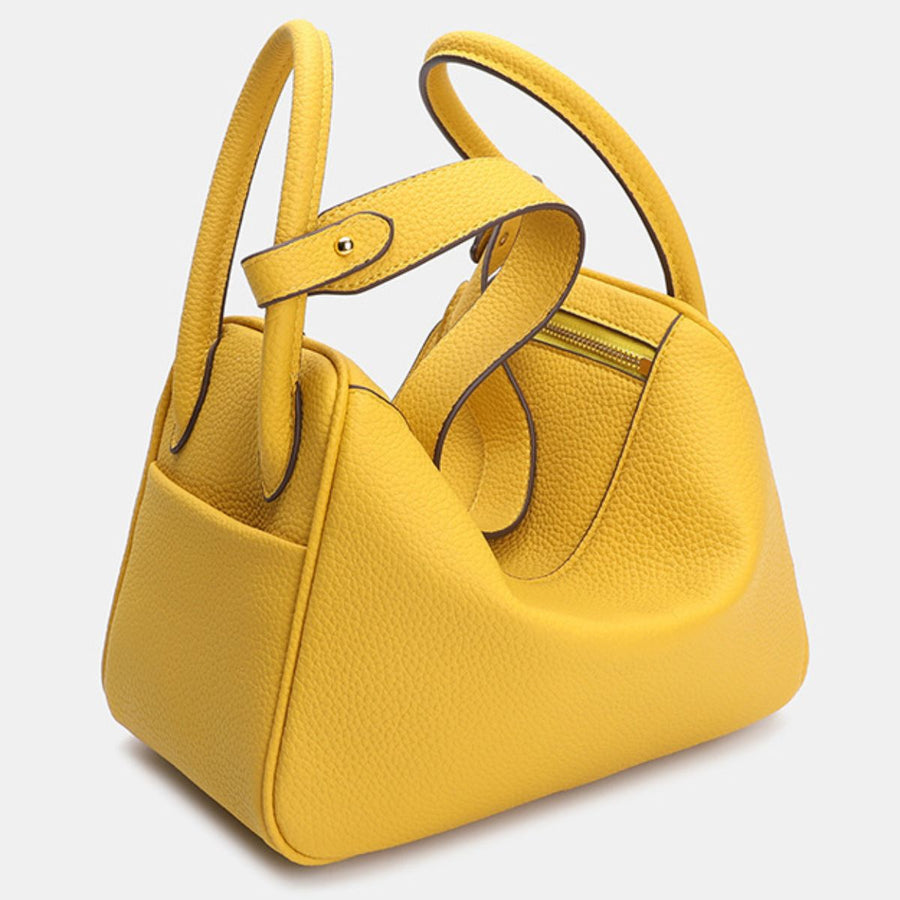 PU Leather Imported Size &amp handbag in bright yellow with rounded silhouette