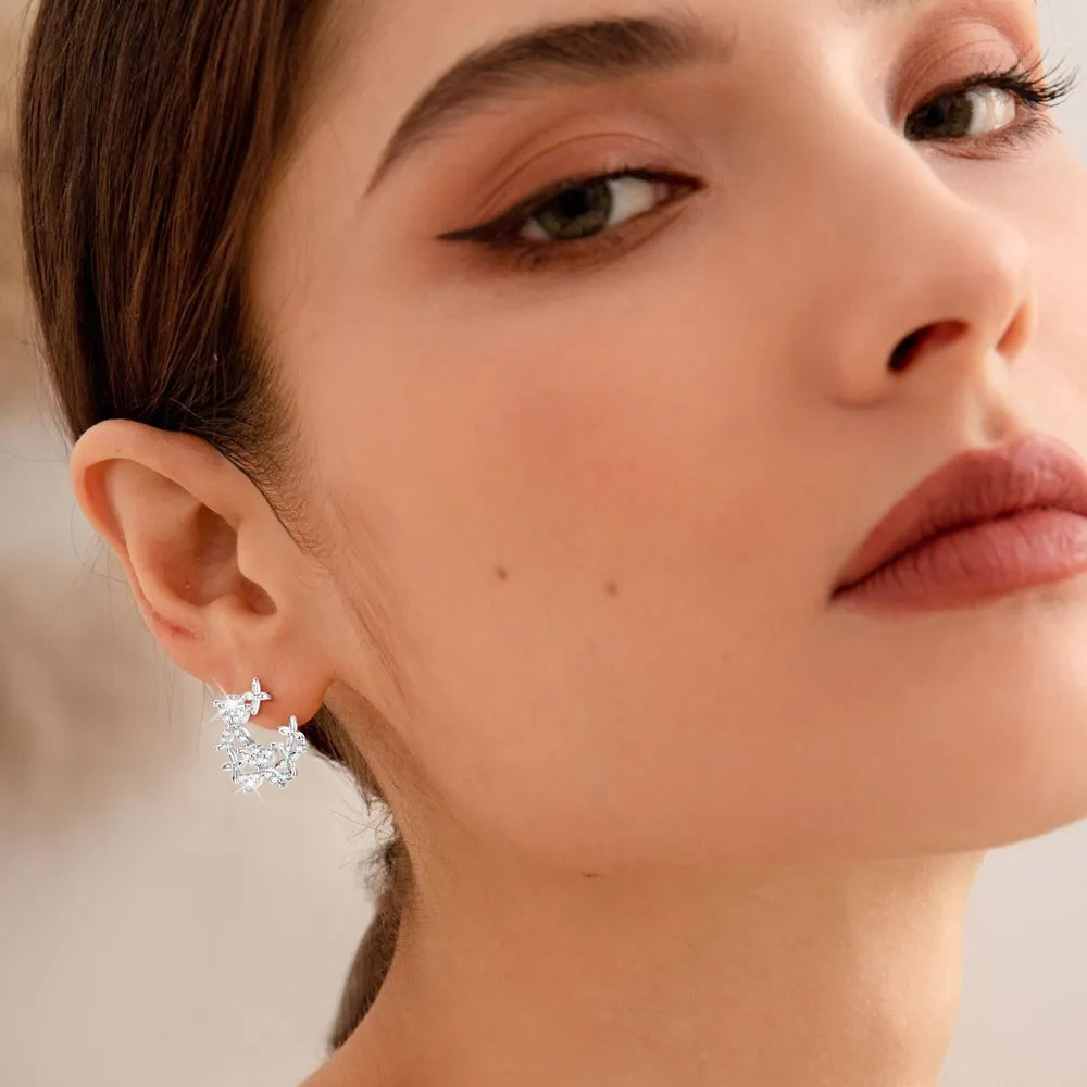Silver floral cluster stud earrings with D color grade stones.