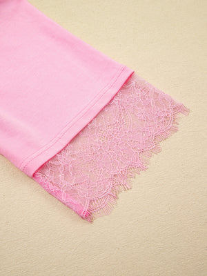 Pink cotton blend oversized tee with floral lace trim detail on the sleeve.