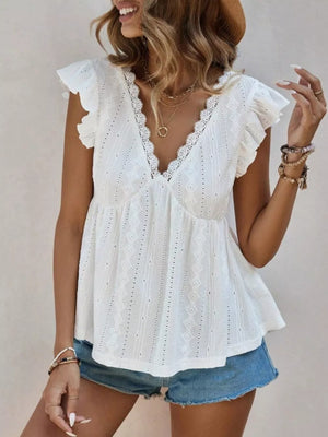 White eyelet blouse with lace trim and ruffle sleeves.