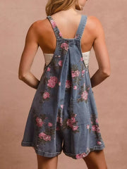 Denim overalls with pink floral print and pocket details