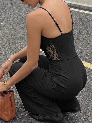 Black lace-trimmed wide-leg maternity romper with spaghetti straps.
