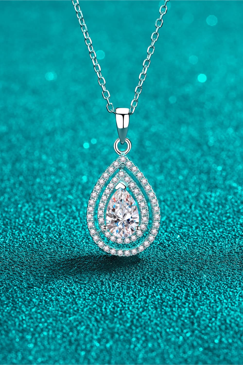 Silver double halo moissanite teardrop necklace on a sterling silver chain.
