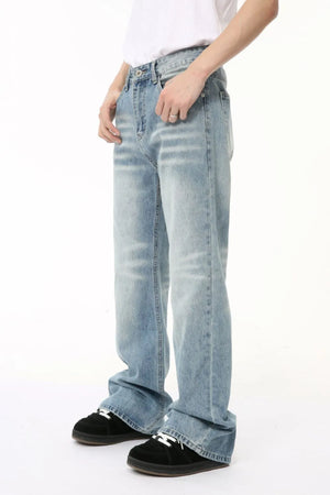 Wide leg washed denim trousers in medium blue with a relaxed fit.