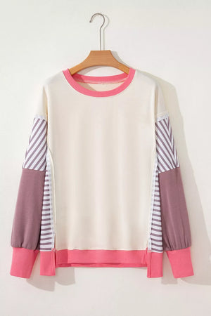 hot pink sweatshirt featuring exposed seam and color-block
