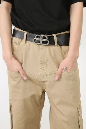 Khaki wide-leg cargo pants with utility pockets and a black belt with a silver buckle.