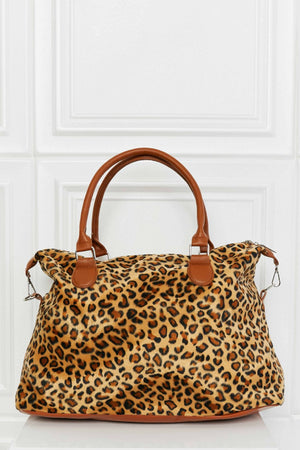 Leopard print travel satchel with brown leatherette trim and handles.