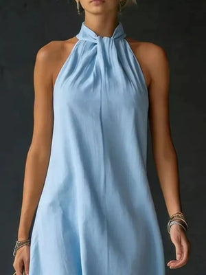Light blue cotton blend maxi dress with twisted halter neckline and a-line cut.