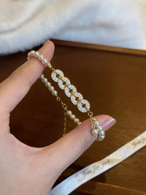 ACCESSORIES in gold with geometric and pearl accents