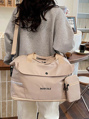 Duffel bag in beige nylon with a front flap pocket, side zip pocket, and MAIKAILE logo.