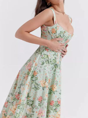 Floral midi dress in sage with sweetheart neckline and side slit, detailed view.