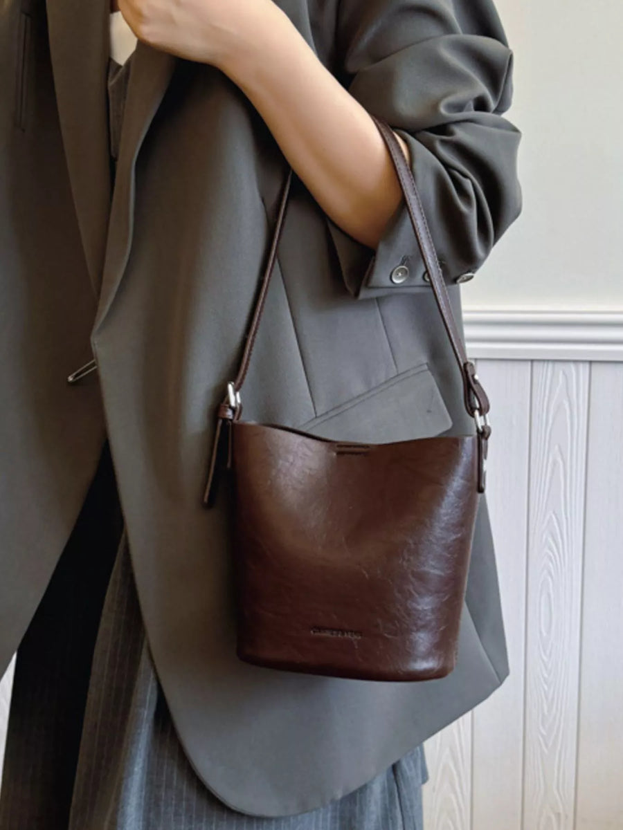 Chocolate leather bucket crossbody bag with adjustable strap
