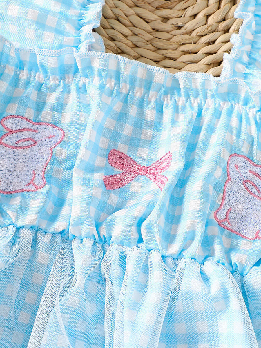 Blue gingham baby set with embroidered bunnies and bows, ruffled neckline, and tulle skirt.