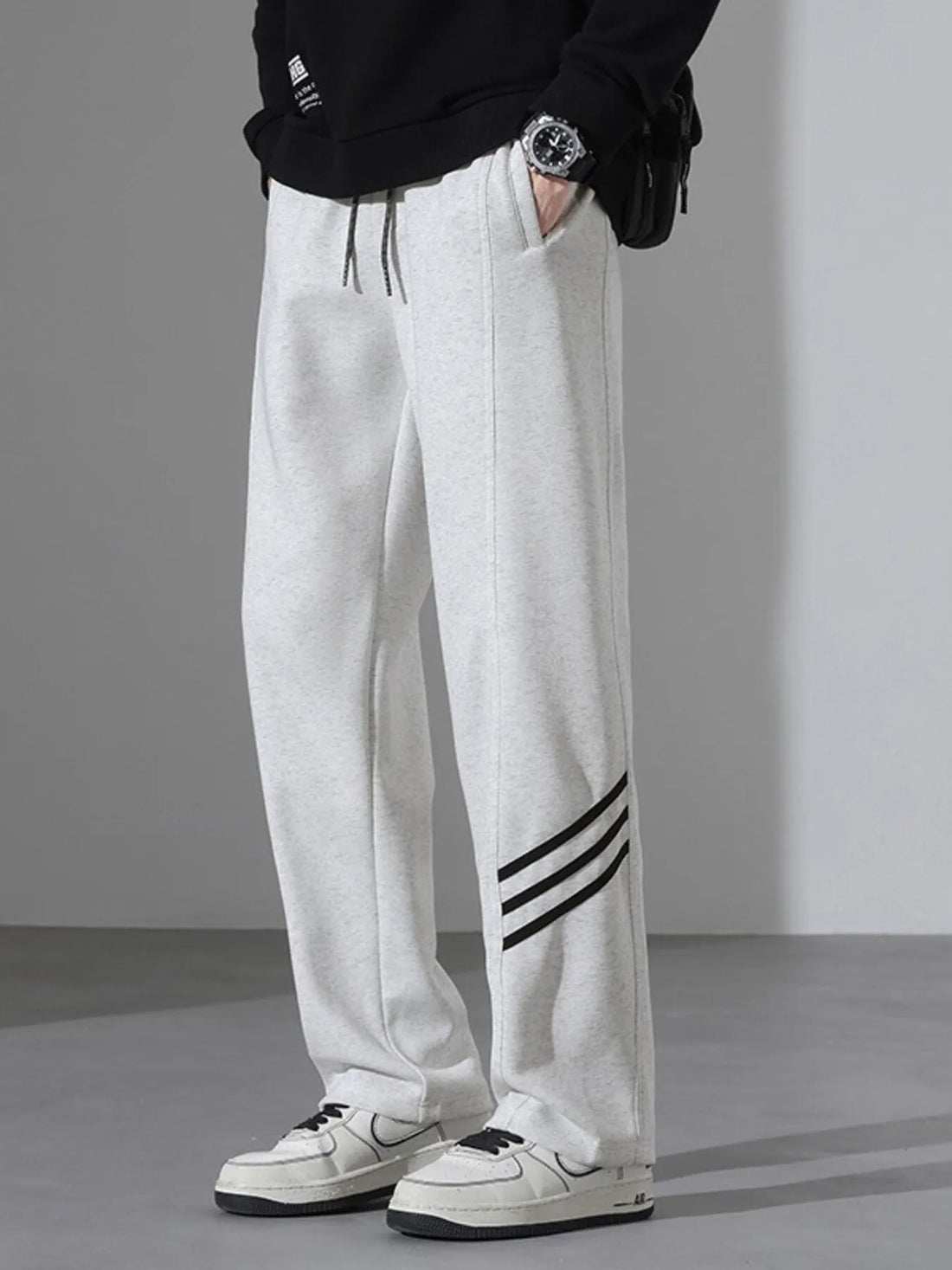 Light Flower Gray casual sweatpants with black side stripes and drawstring waist.