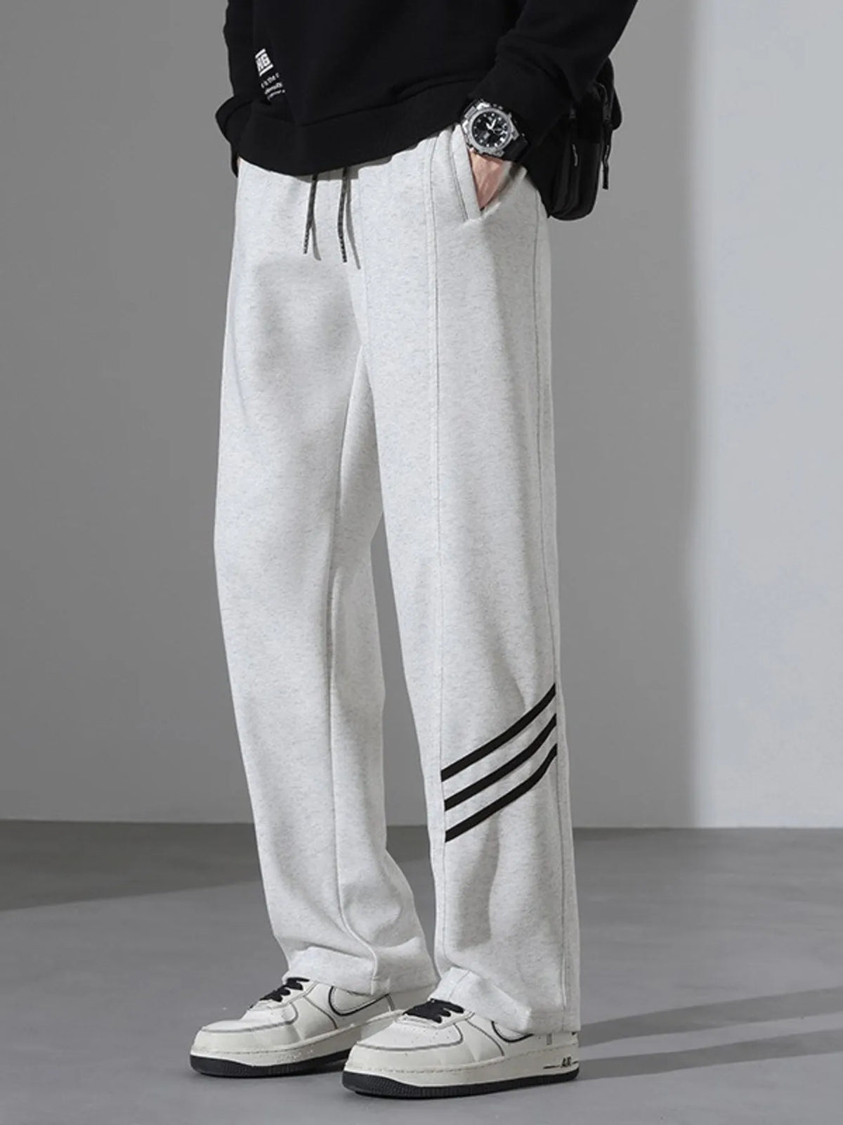 Light Flower Gray casual sweatpants with black side stripes and drawstring waist.