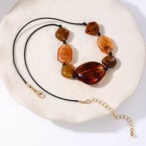 18K Gold-Plated, Alloy, Acrylic Care instructions: Avoid wearing during exercise necklace in dark brown with straight